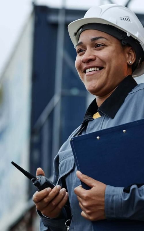 woman-working-at-shipping-docks-with-containers.jpg